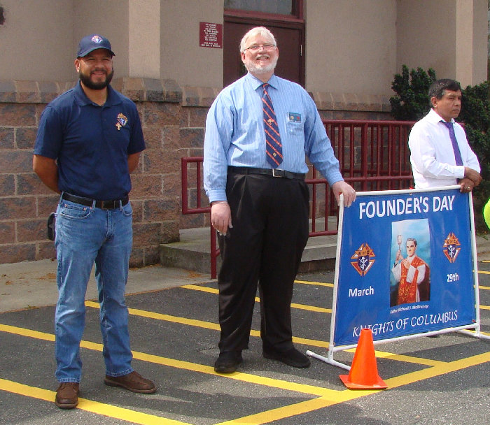 Chancellor Freddie Garcia (ball cap) and Grand Knight Eddie Williams at founder's day